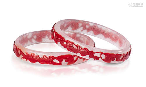 A PAIR OF RED OVERLAY GLASS 'BATS AND PEACHES' BANGLES 19th ...