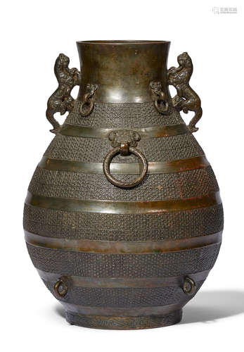 A RARE ARCHAIC BRONZE RITUAL WINE VESSEL, HU Eastern Zhou Dy...