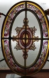 OVAL PAINTED GLASS WINDOW IN IRON FRAME C.1920