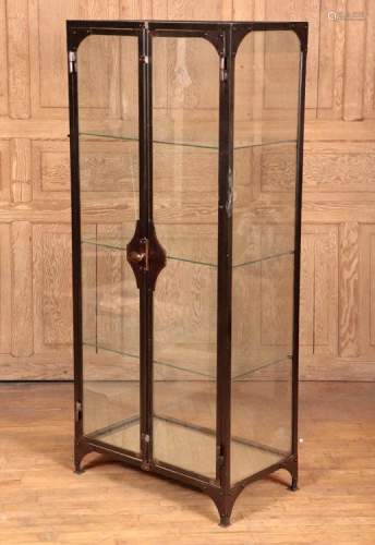 TWO DOOR GLASS AND IRON VITRINE CIRCA 1910