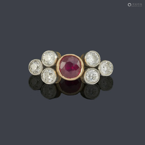 Ring with central ruby flanked by ancient