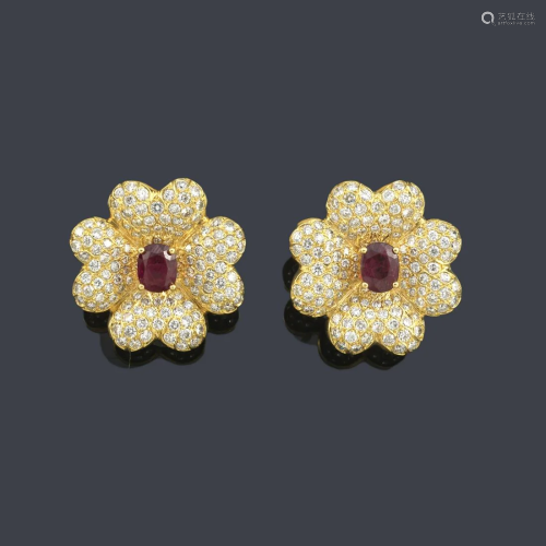 Short earrings in the shape of a flower with a pair of