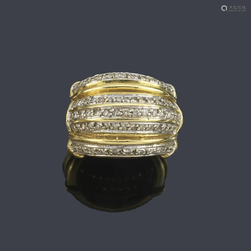 Wide ring with a gallon front with bands of diamonds in