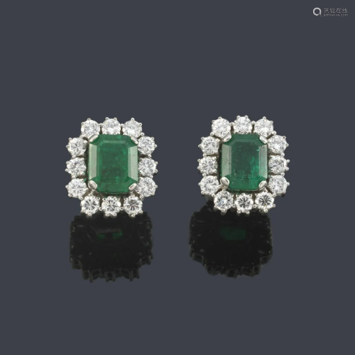 Short earrings with emeralds and a border of diamonds