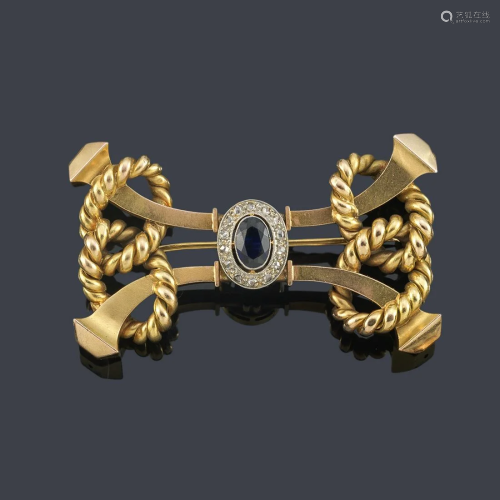 Double sailor knot motif brooch with a sapphire center