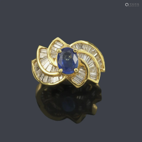 Ring with oval cut sapphire and baguette cut diamonds