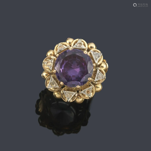 Round cut synthetic alexandrite ring with diamonds in