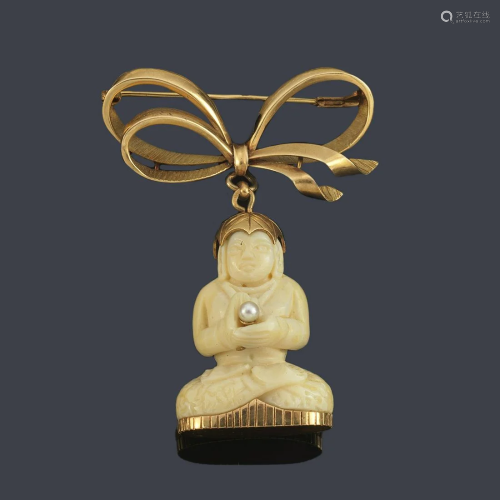 Ivory Buddha figure brooch with double bow at the top