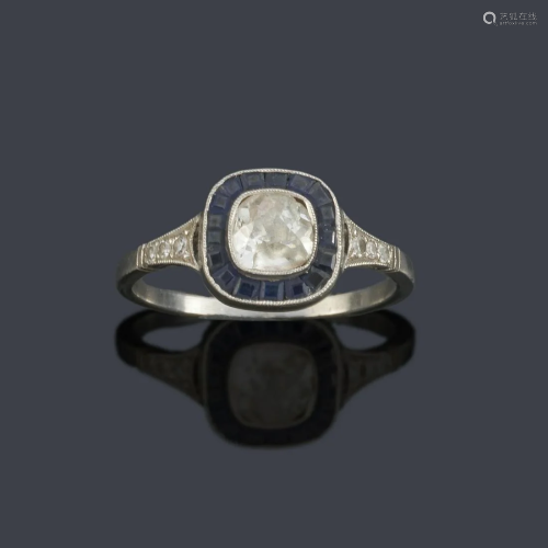 Antique cut diamond ring with calibrated sapphire