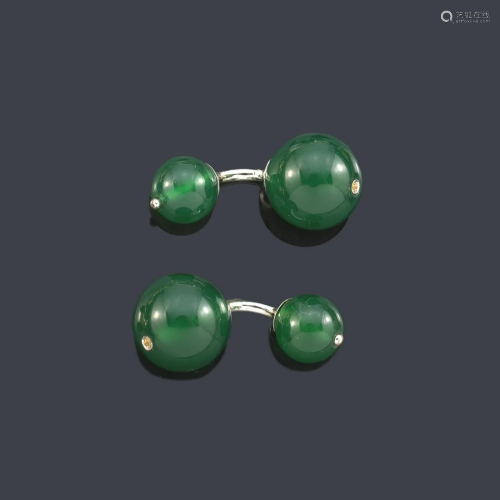 Cufflinks with a pair of spherical motifs in green
