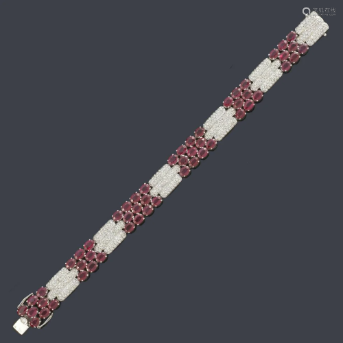 LUIS GIL Articulated bracelet with oval cut rubies of