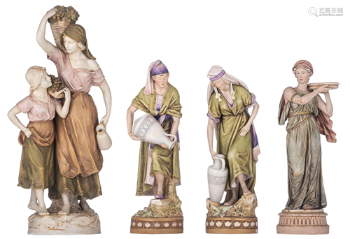 A collection of four Royal Dux biscuit figurine groups