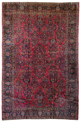 A large Oriental Sarouk rug, decorated with floral