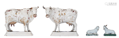 A pair of Delftware cows and a smaller pair of lying