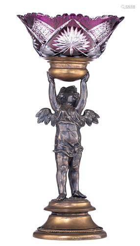 A silver-plated brass stand, shaped like an angel