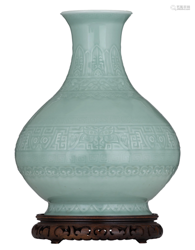 A Chinese archaistic Anhua celadon-glazed bottle vase,