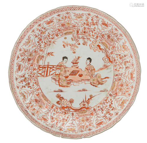 A Chinese iron-red plate, decorated with figures,