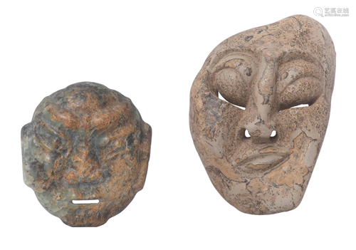 Two carved stone masks, largest mask 23 x 15 cm