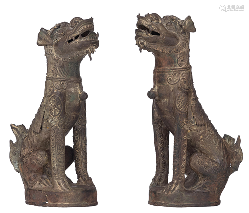 A pair of Chinese Yuan-Ming style bronze guardian