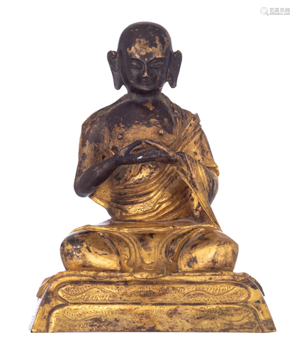 A Chinese gilt-bronze figure of a seated lama, H 15 cm