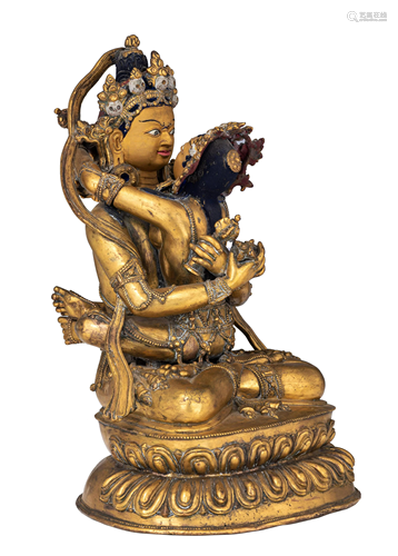 A Sino-Tibetan gilt-bronze figure of a Buddhist deity