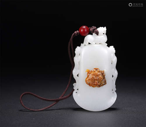 A Carved White Jade Ax-shaped Pendant