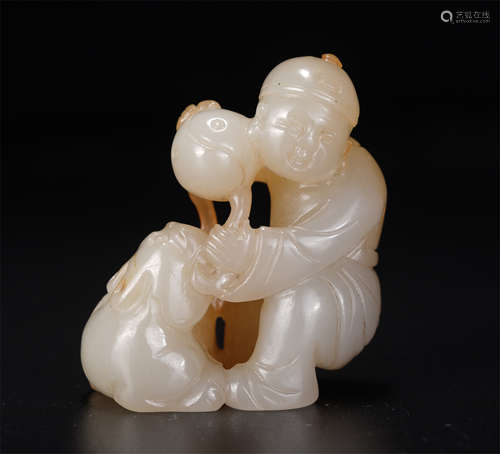 A Carved White Jade Kid