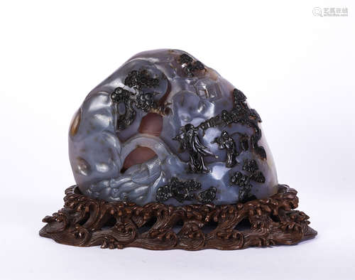 A Carved Agate Boulder with Wooden Stand