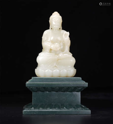 A Carved White Jade Seated Shakyamuni on Spinach Green Jade ...