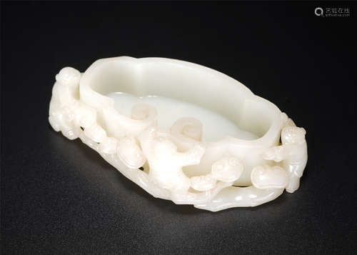 A Carved White Jade Kids Washer