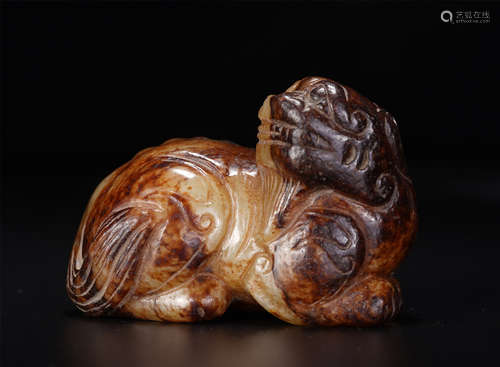 A Carved Russet and White Jade Beast