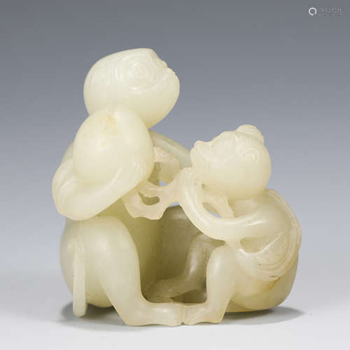 A CHINESE CARVED WHITE JADE MONKEYS GROUP