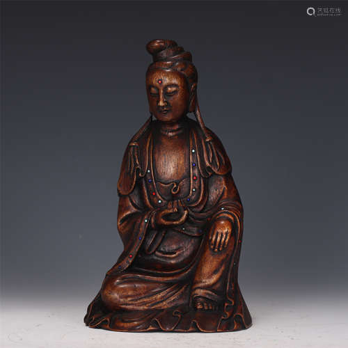 A CARVED CHENXIANG AGAR-WOOD SEATED GUANYIN