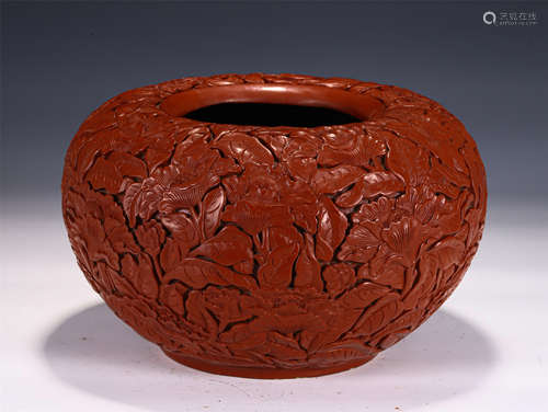 A CARVED CINNABAR LACQUER JAR