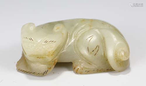 A CARVED WHITE AND RUSSET JADE ORNAMENT