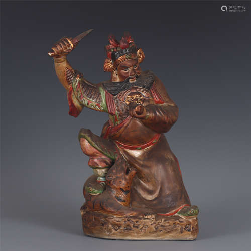 A CHINESE PORCELAIN FIGURE