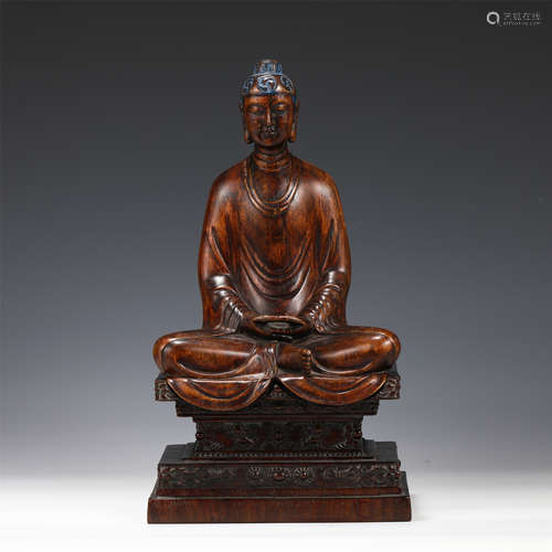 A CARVED CHENXIANG SEATED BUDDHA