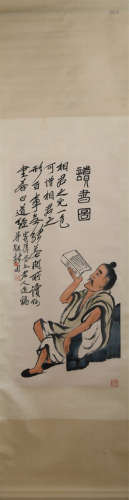 A CHINESE PAINTING DEPICTING READING A BOOK
