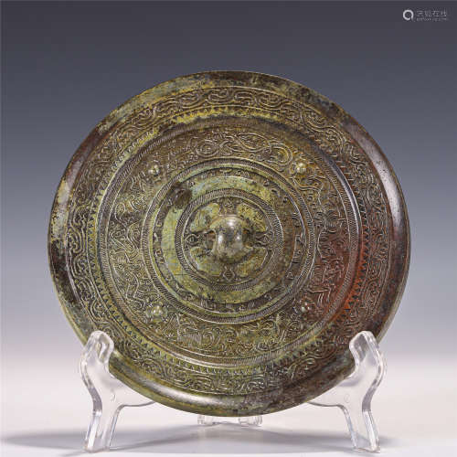 A CHINESE BRONZE MIRROR WITH CARVINGS