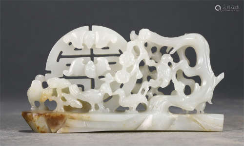 A RETICULATED WHITE JADE CARVING