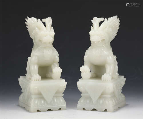 MATCHED PAIR OF CARVED JADE FOO DOGS