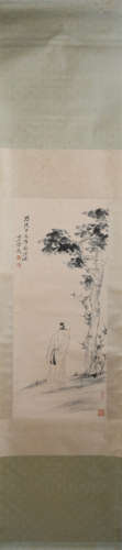 A CHINESE PAINTING OF FIGURE STANDING UNDER A TREE