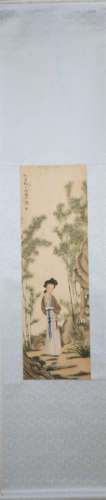 A CHINESE PAINTING OF LADY AND BAMBOOS