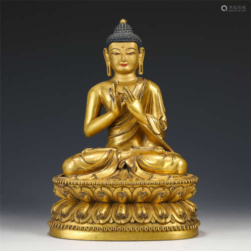 A GILT BRONZE FIGURE OF SHAKYAMUNI