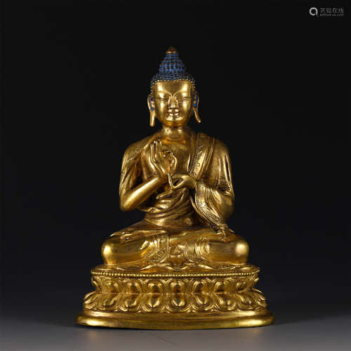 A GILT BRONZE FIGURE OF SHAKYAMUNI