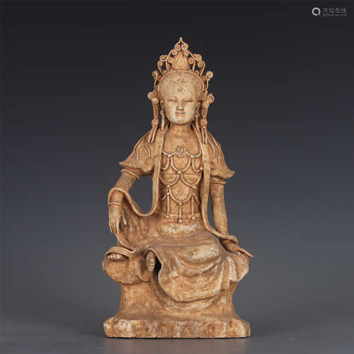 A CHINESE UNGLAZED POTTERY GUANYIN