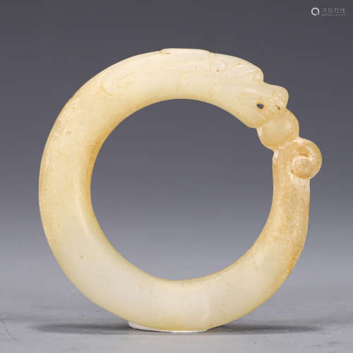 A CARVED WHITE JADE DECORATION
