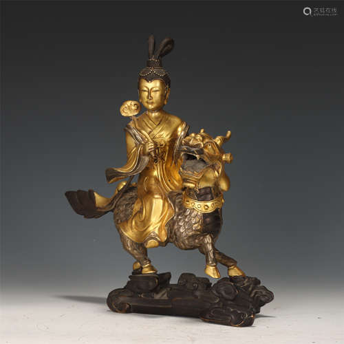 A CHINESE GILT-BRONZE APSARAS ON BEAST