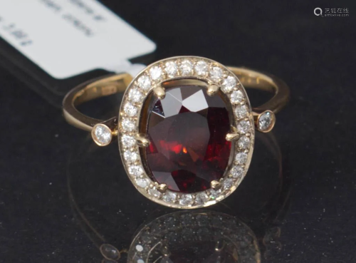 Gold ring with garnet and diamonds