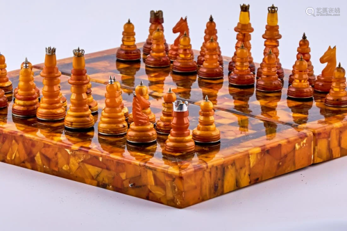 Baltic amber chess set with silver decorative elements